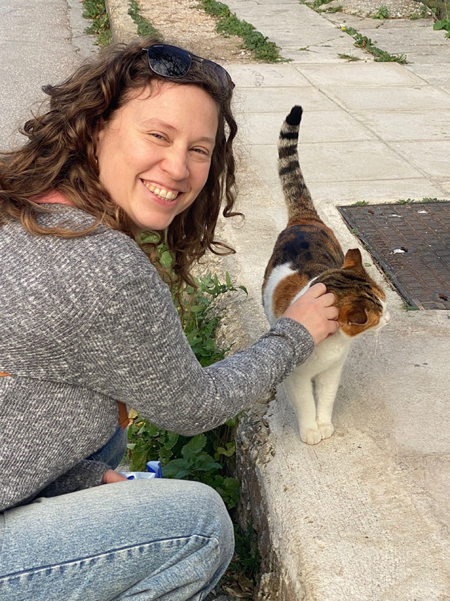Mor petting a street cat