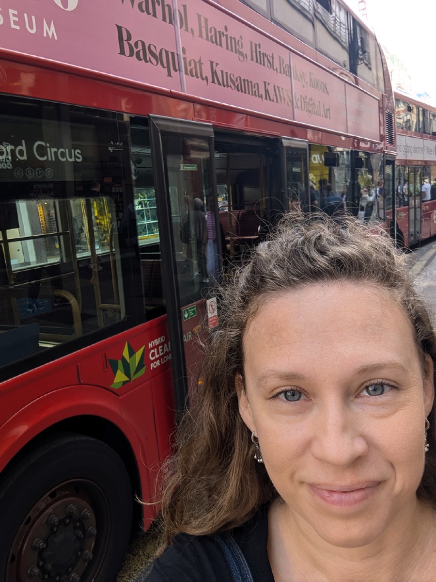 Mor taking a selfie by a London bus